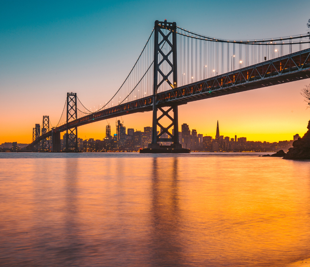 San Francisco Bay Bridge skyline at sunset